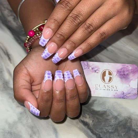 May be an image of text that says 'O CLASSY HABES 62 SALON ISALON& & &SPA AIESSALONASPA SPA'