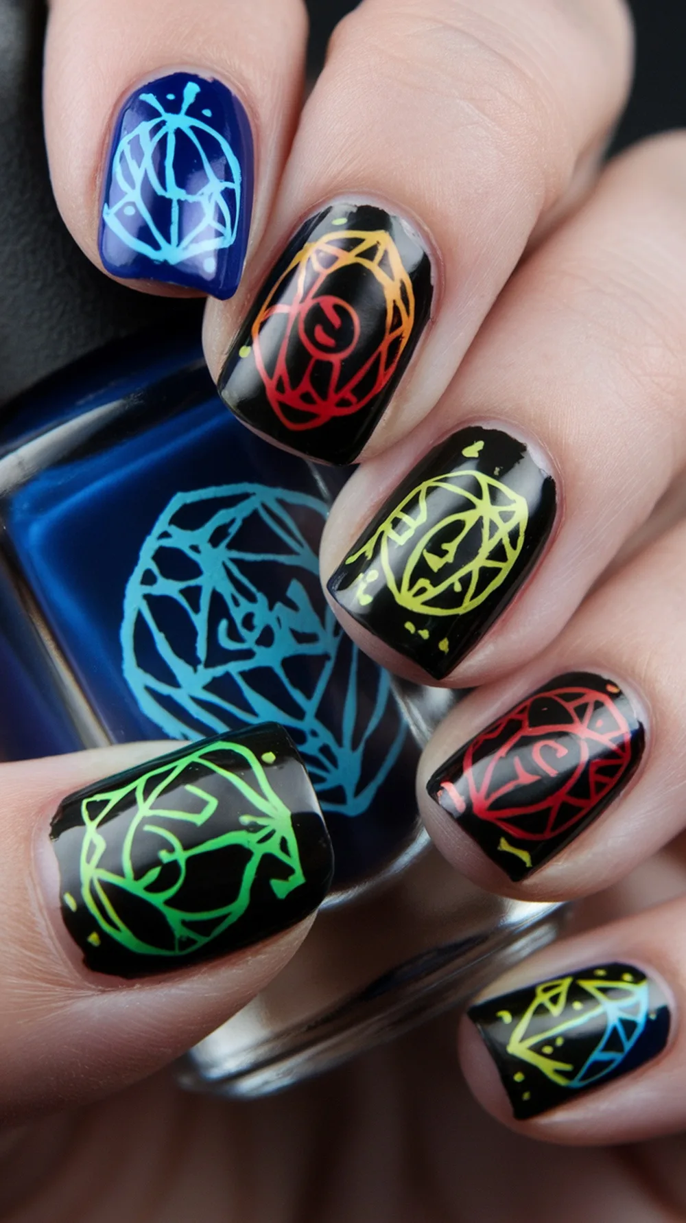 Colorful Halloween nail designs featuring crystal ball patterns.